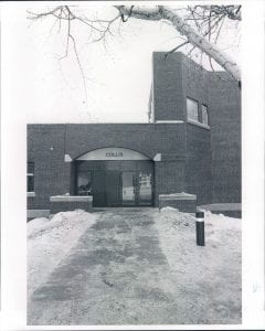 The entrance to the Collis Center, behind a snow covered path.