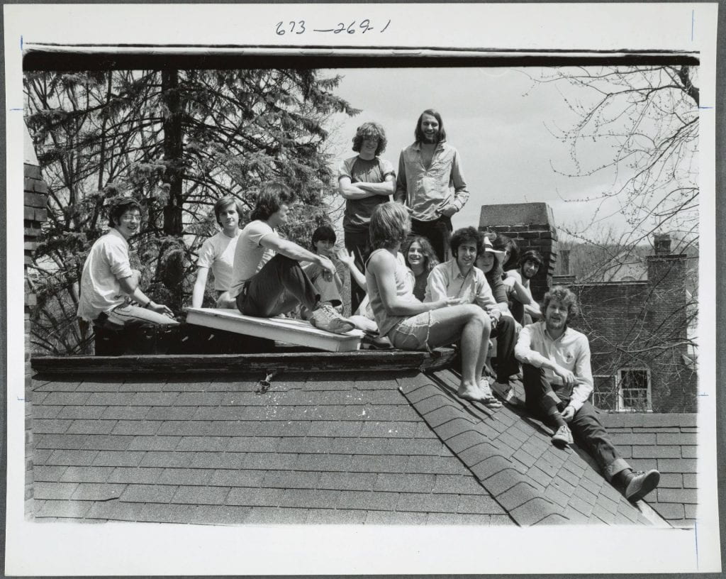 A group of students relaxing on the roof of Foley House.