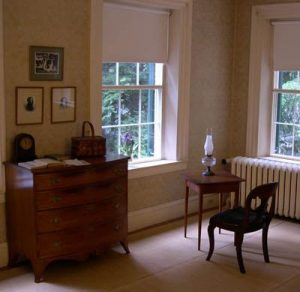 Dickinson's room with three portraits